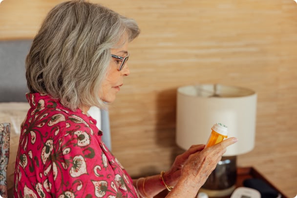 woman looking at her prescription