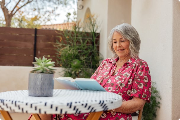 woman reading a book outside
