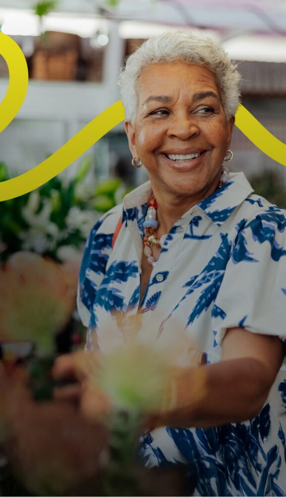 smiling woman shopping for flowers